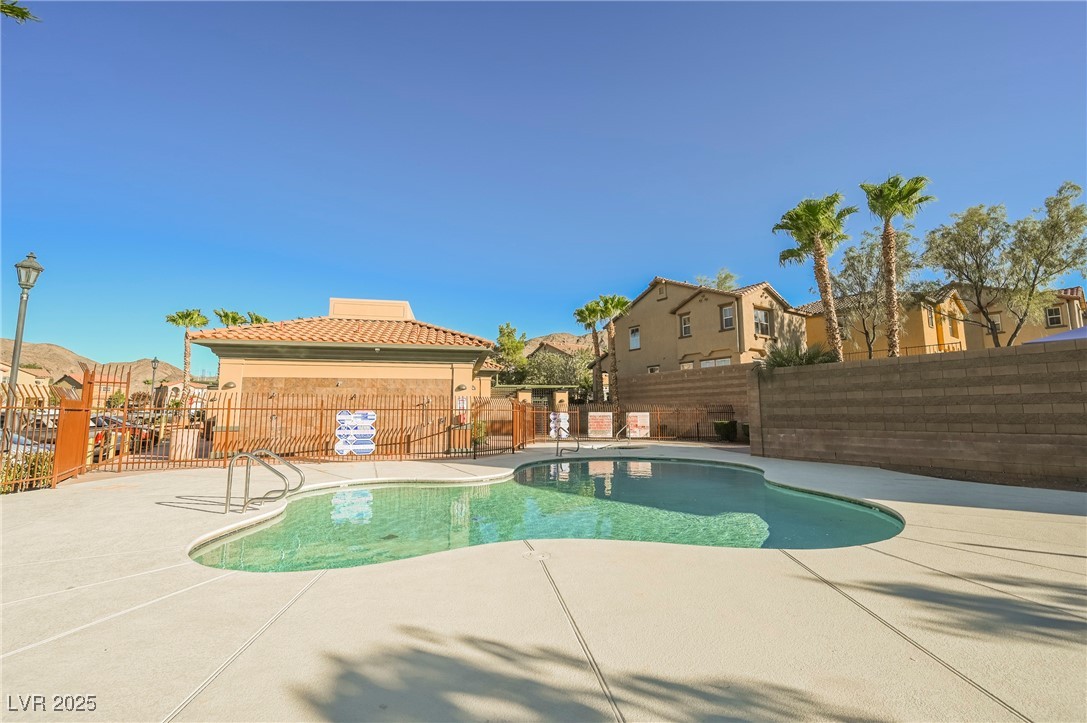 1161 Gecko Road Henderson, NV 89002 - Photo 50 of 54 Community pool with a fenced backyard, a patio area, and a residential view