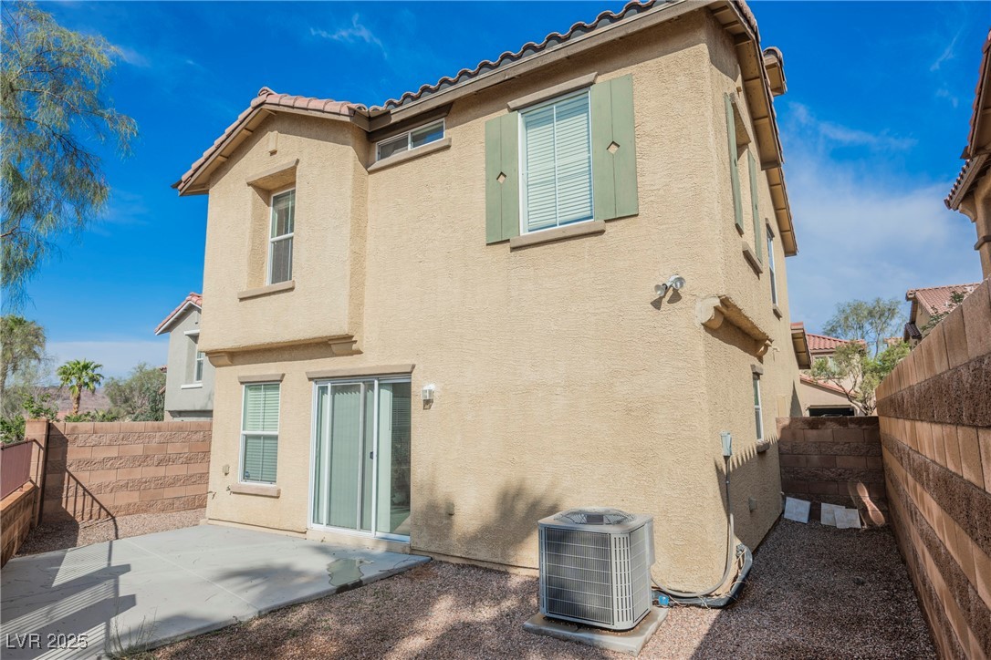 1161 Gecko Road Henderson, NV 89002 - Photo 10 of 54 Back of property with stucco siding and a fenced backyard