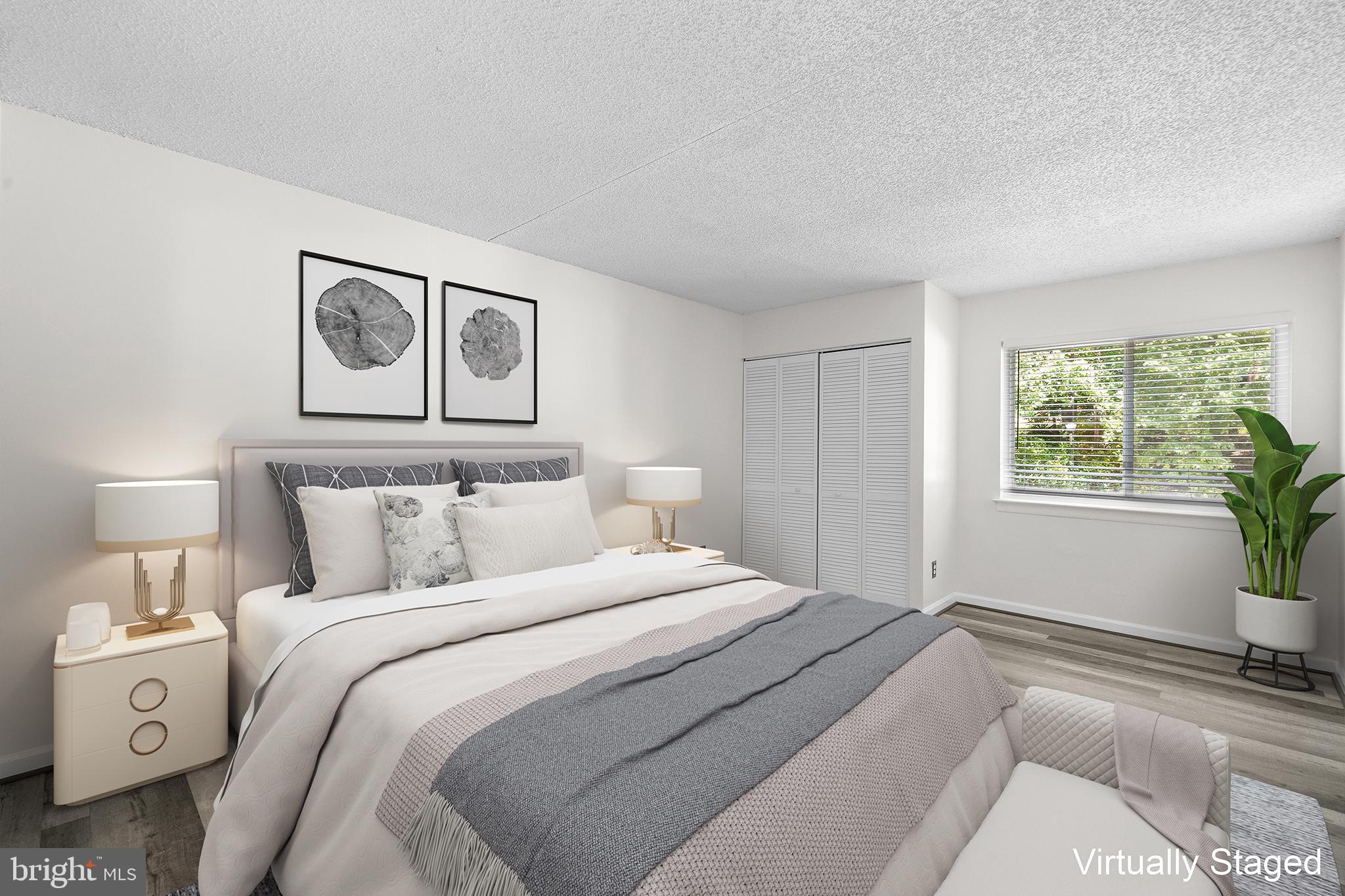 11835 Shire Court, Unit 12C Reston, VA 20191 - Photo 14 of 28 a bedroom with a large bed and a window