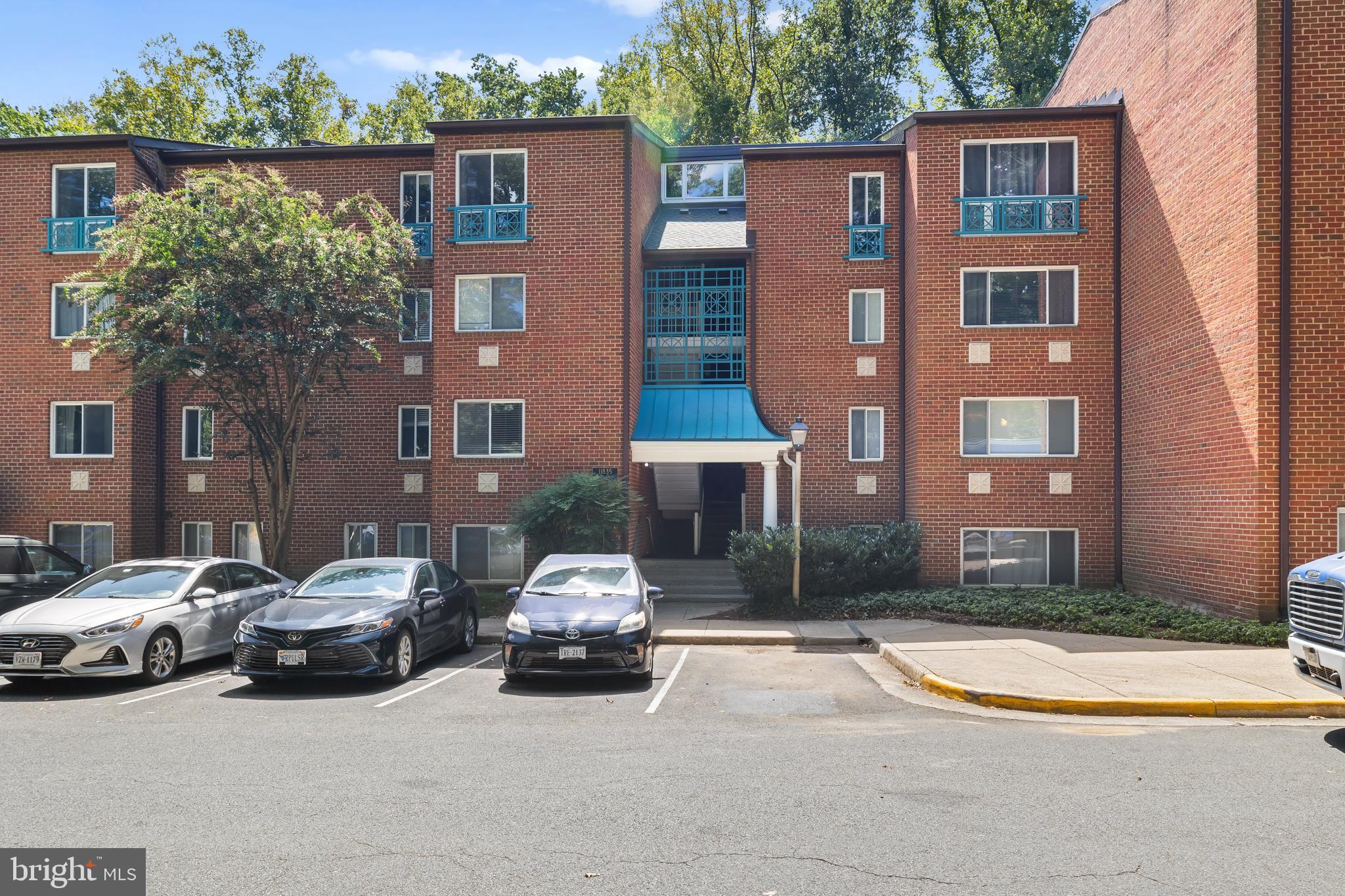 11835 Shire Court, Unit 12C Reston, VA 20191 - Photo 21 of 28 a car parked in front of a building