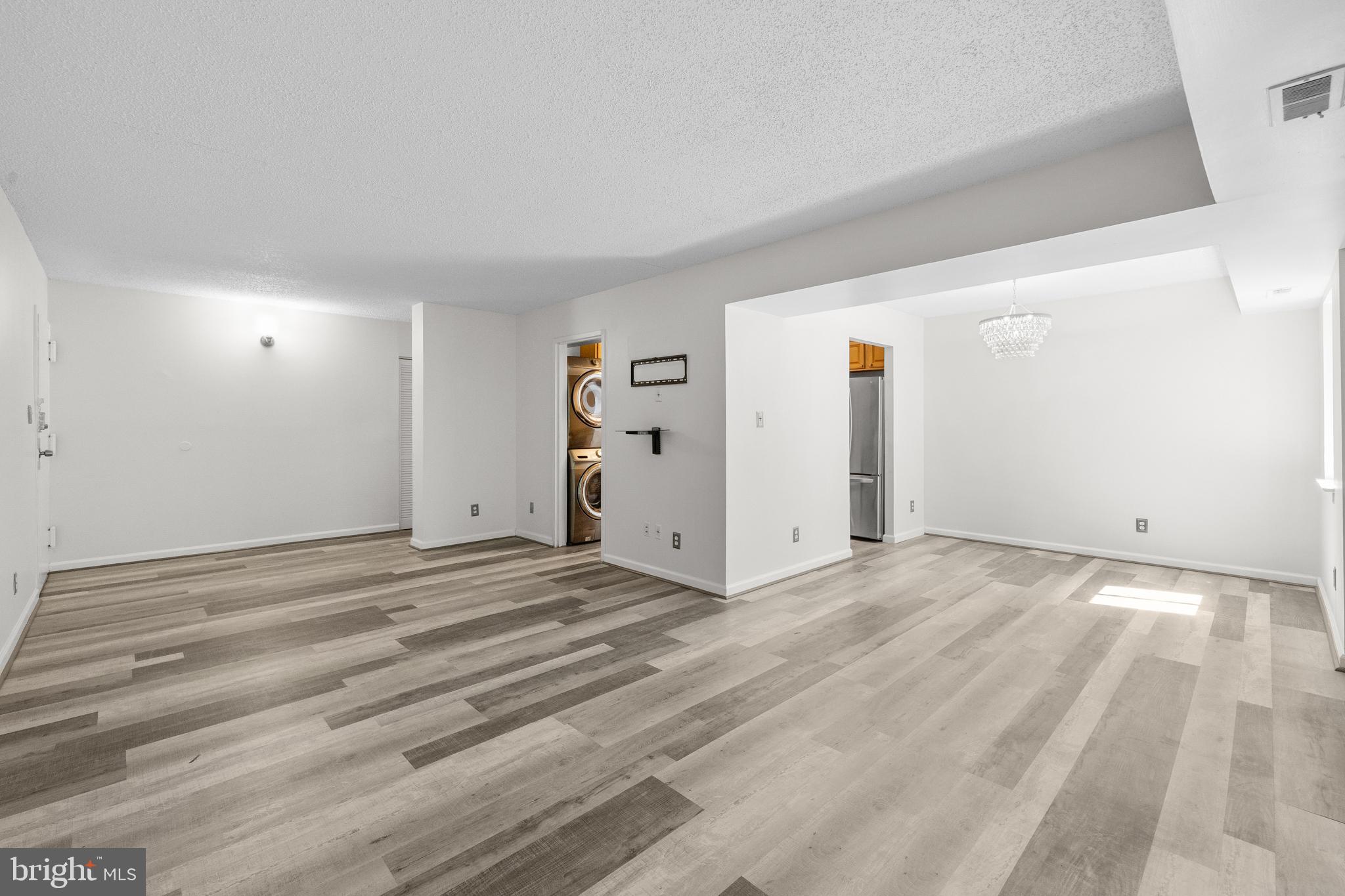 11835 Shire Court, Unit 12C Reston, VA 20191 - Photo 6 of 28 a view of a livingroom with wooden floor and closet
