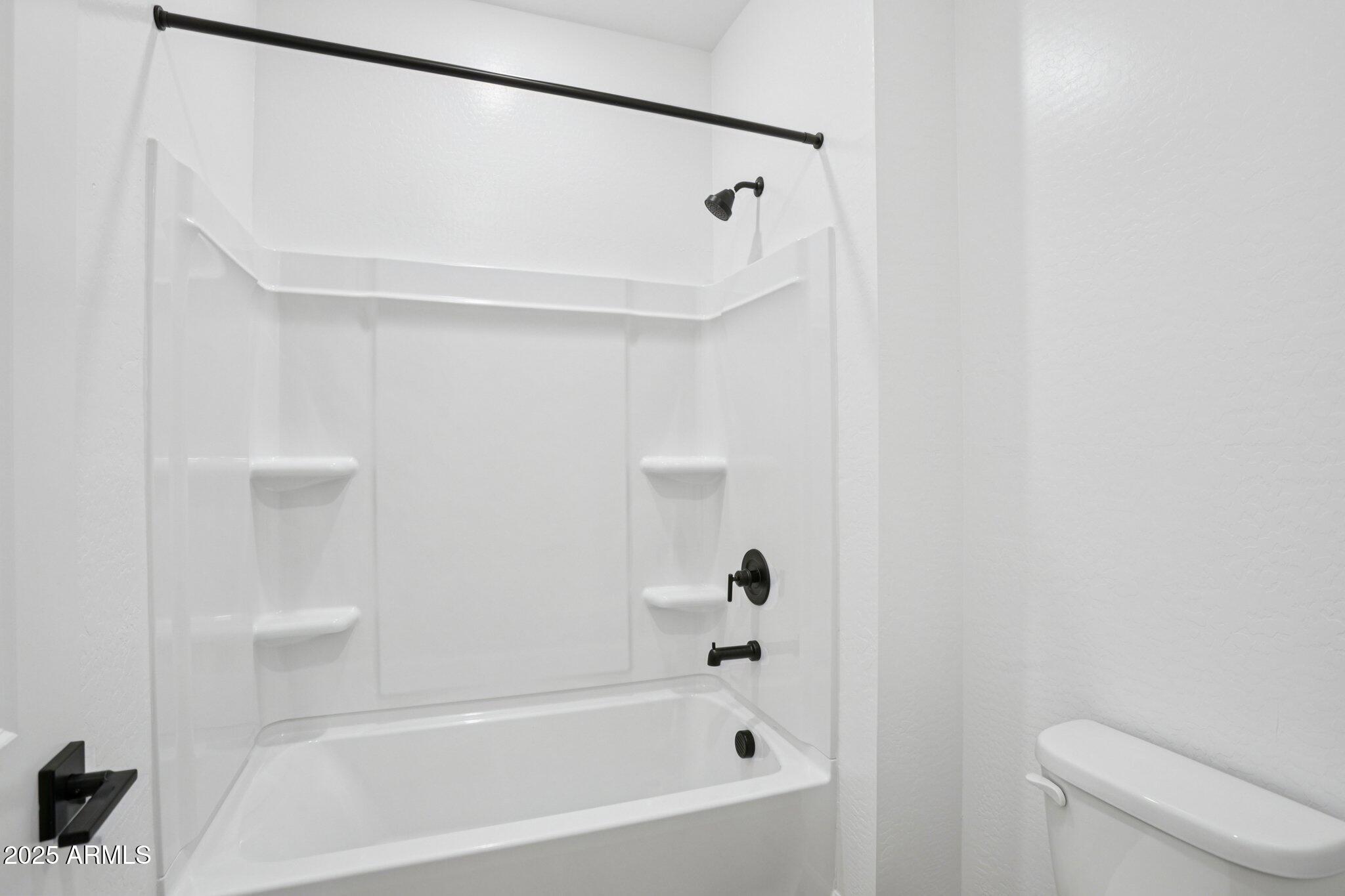 15722 West Brown Street Waddell, AZ 85355 - Photo 27 of 61 a bathroom with a bathtub