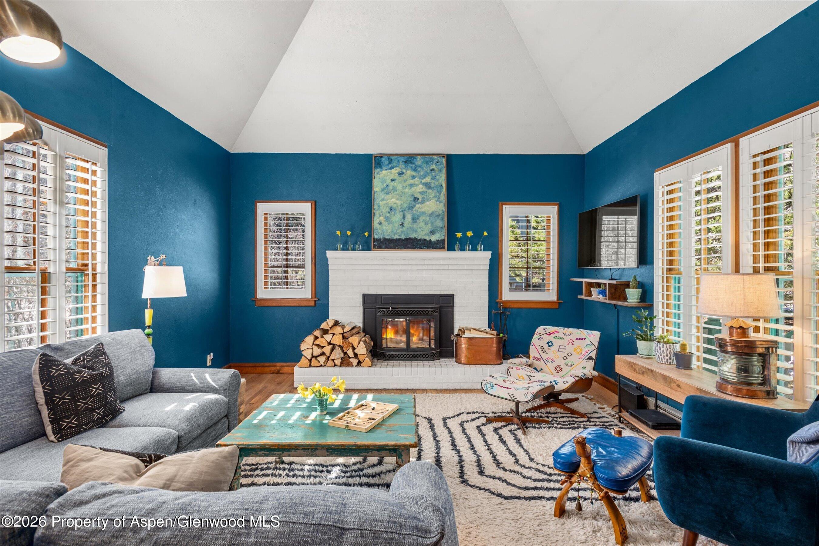 244 Redstone Boulevard Redstone, CO 81623 - Photo 11 of 55 a living room with furniture fireplace and a large window