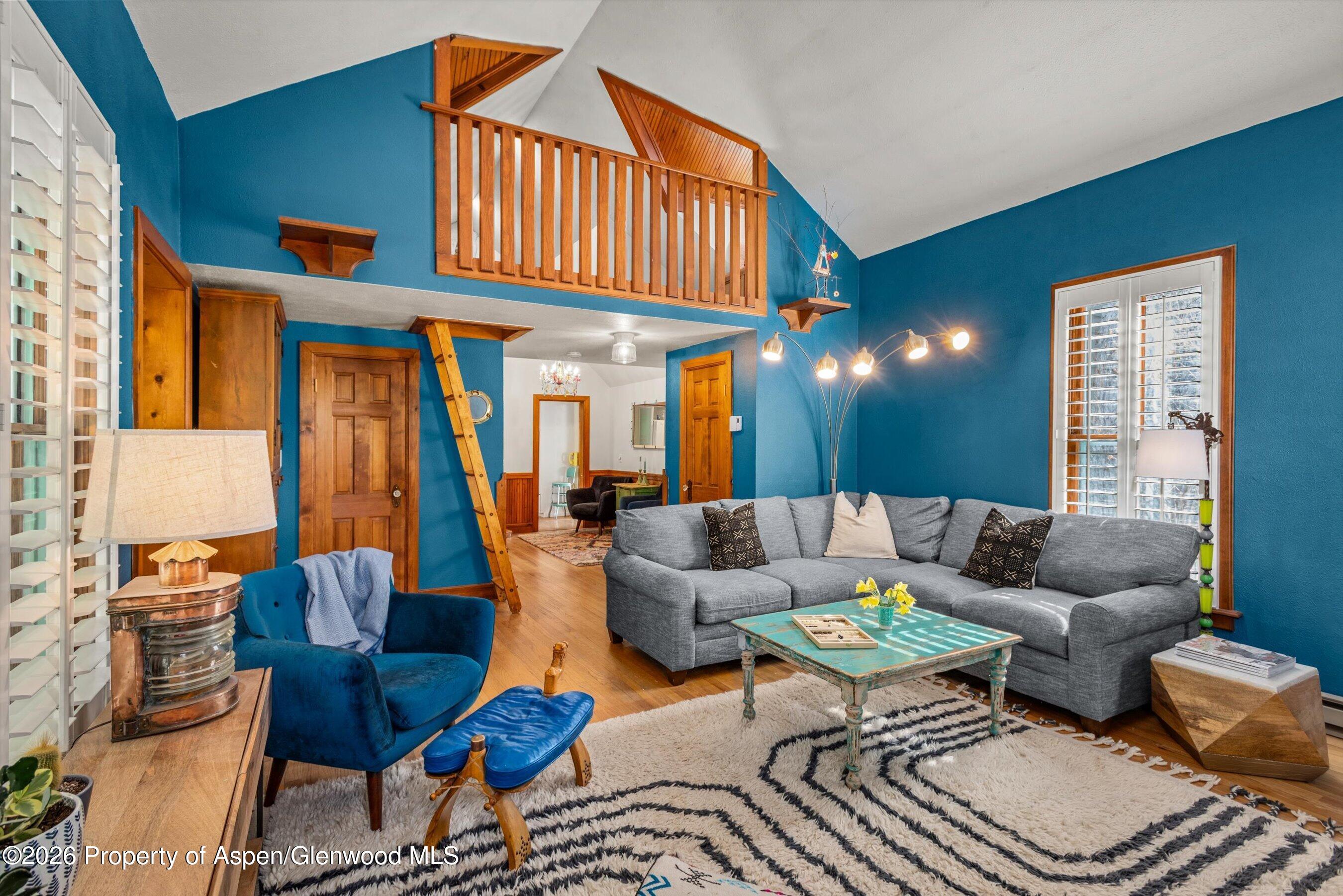244 Redstone Boulevard Redstone, CO 81623 - Photo 15 of 55 a living room with furniture a ceiling fan and a window