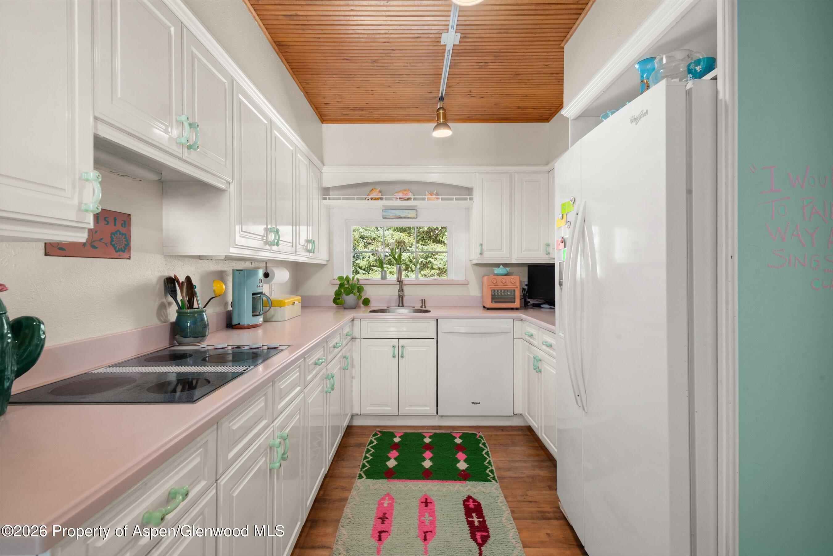 244 Redstone Boulevard Redstone, CO 81623 - Photo 20 of 55 a kitchen with sink refrigerator and window