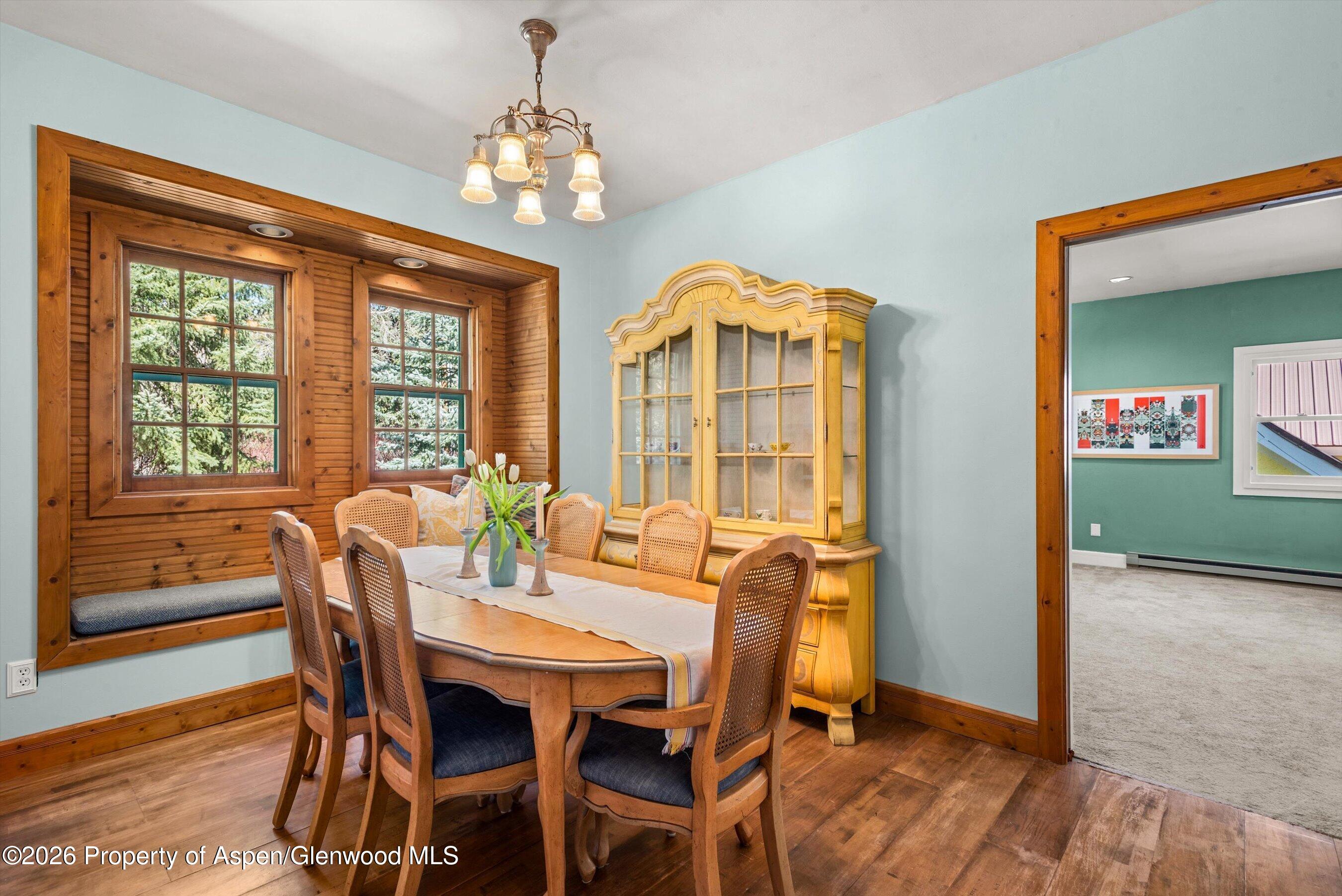 244 Redstone Boulevard Redstone, CO 81623 - Photo 24 of 55 a view of a dining room with furniture window and wooden floor