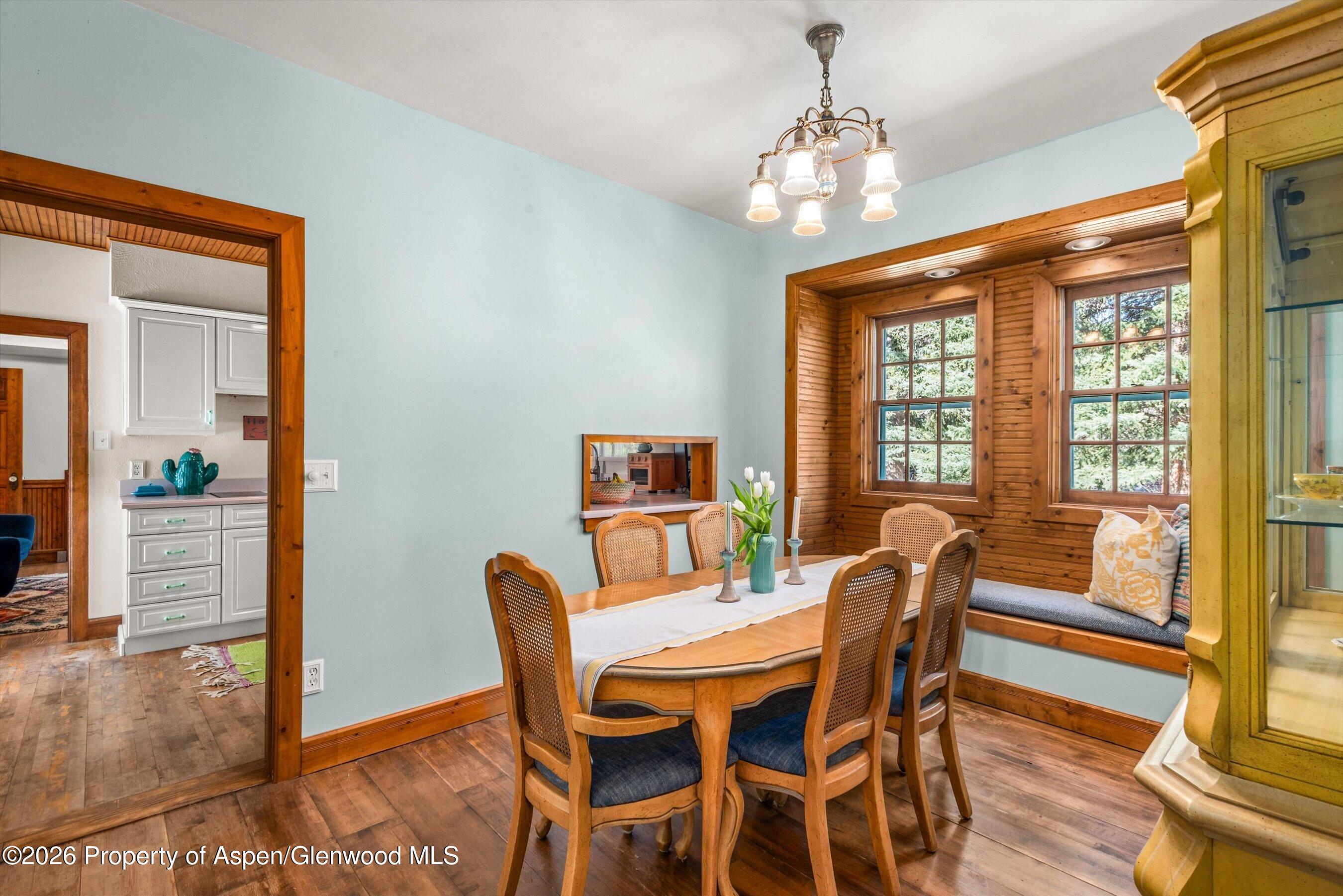 244 Redstone Boulevard Redstone, CO 81623 - Photo 25 of 55 a view of a dining room with furniture window and wooden floor