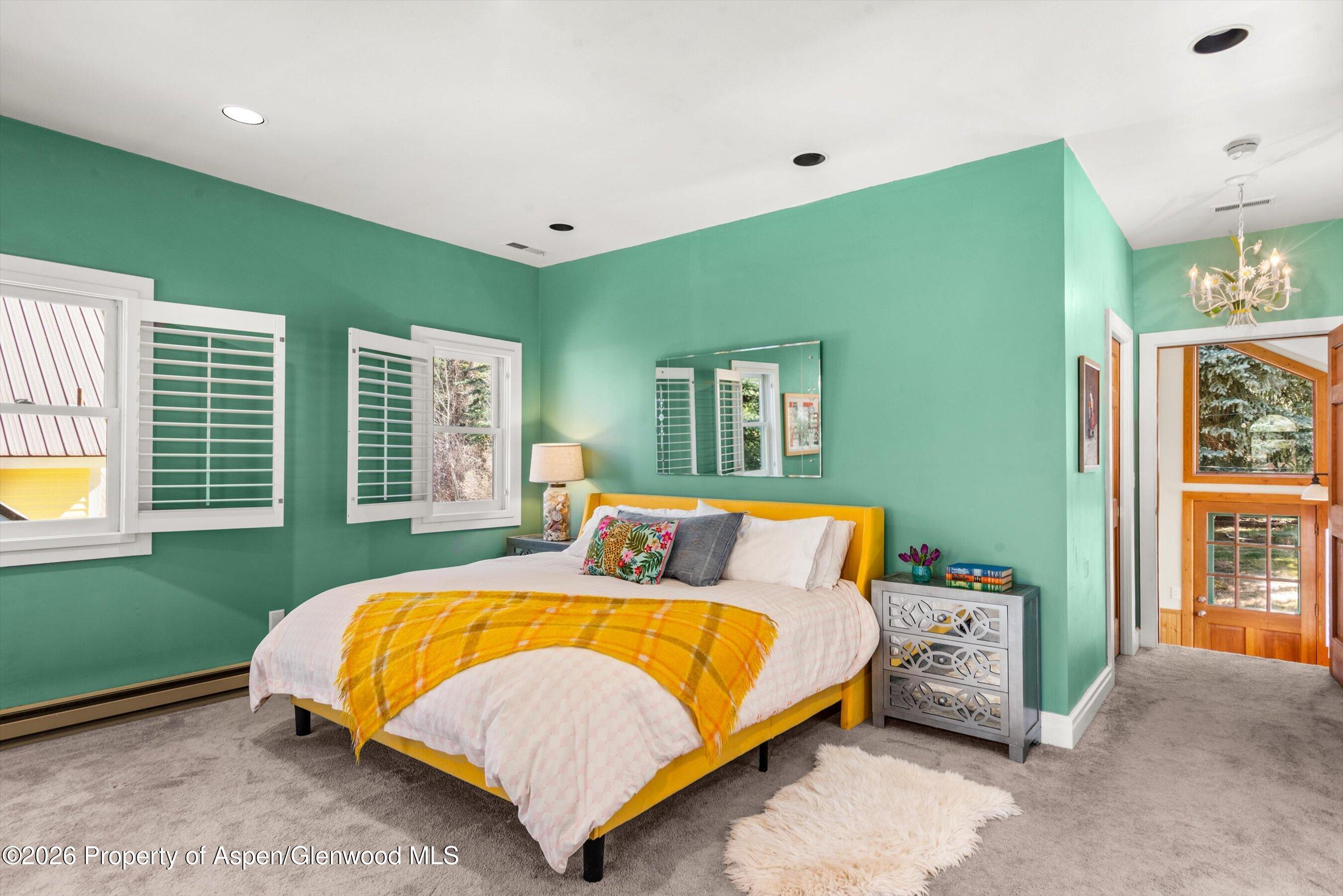 244 Redstone Boulevard Redstone, CO 81623 - Photo 27 of 55 a bedroom with a bed and a window