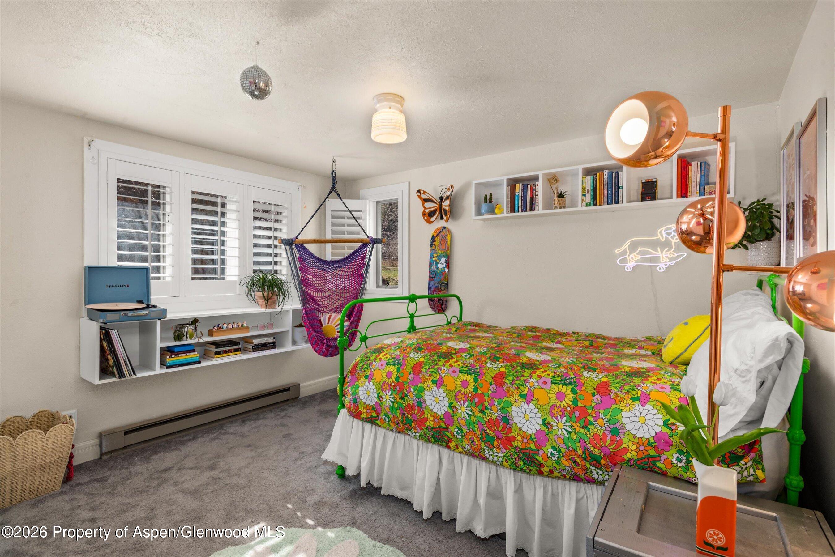 244 Redstone Boulevard Redstone, CO 81623 - Photo 32 of 55 a bedroom with bed and a window