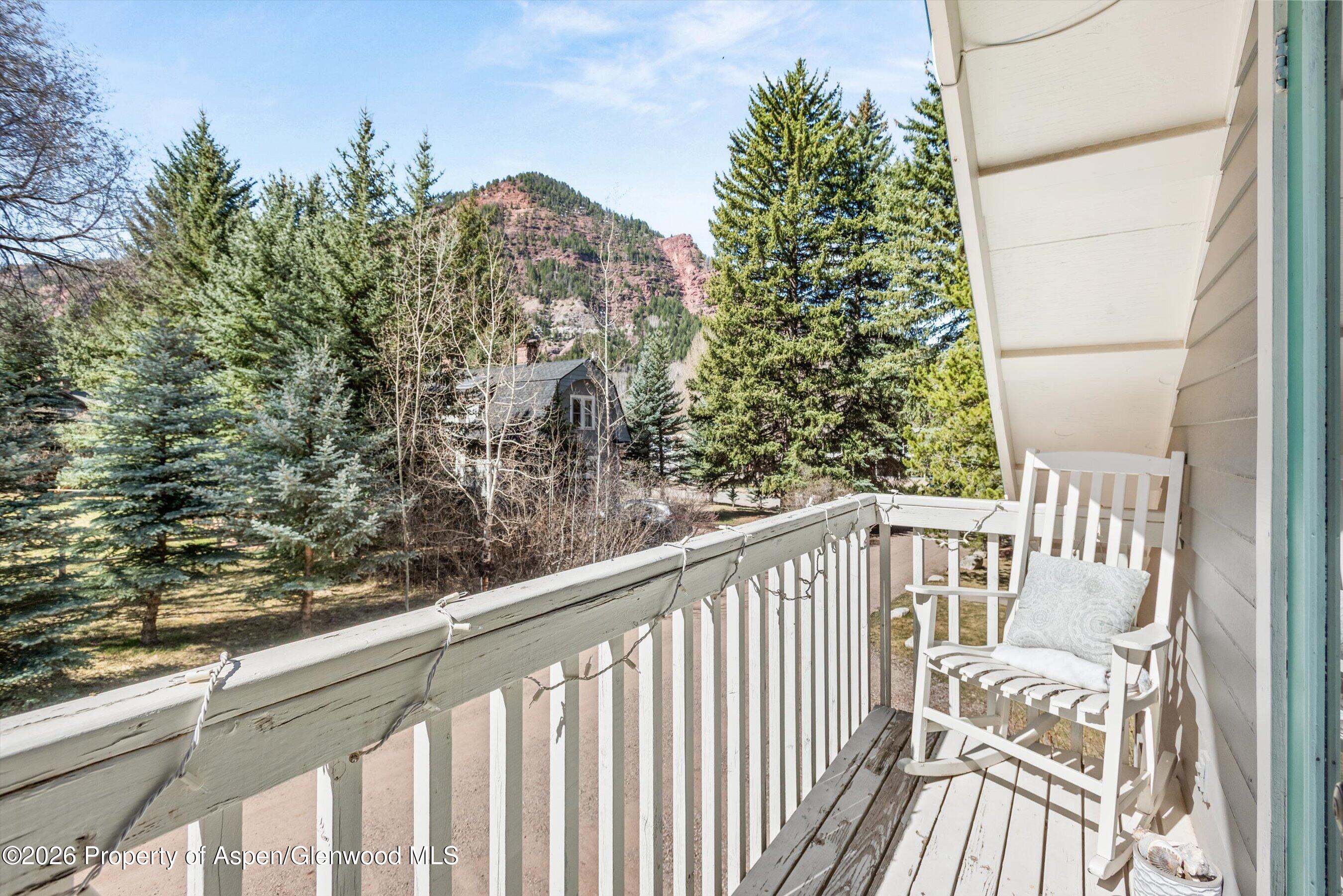 244 Redstone Boulevard Redstone, CO 81623 - Photo 41 of 55 a view of balcony with wooden floor and fence