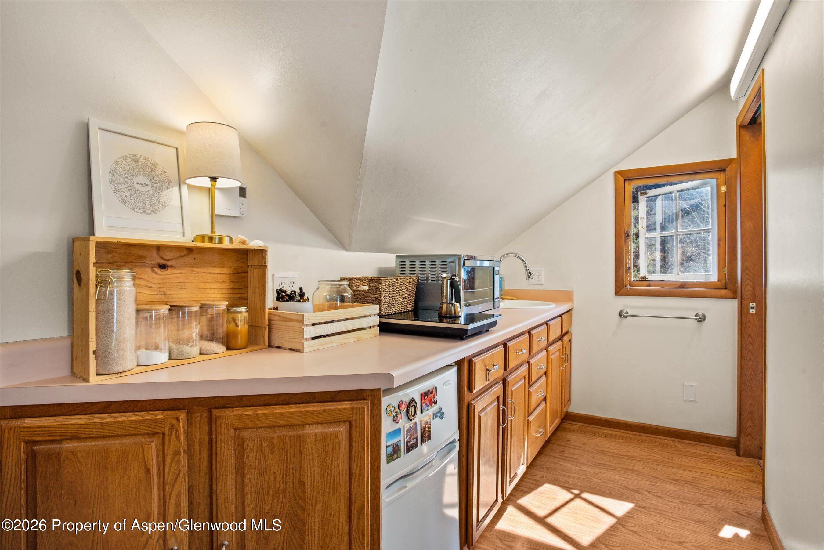 244 Redstone Boulevard Redstone, CO 81623 - Photo 43 of 55 a kitchen with stainless steel appliances granite countertop a sink and a refrigerator