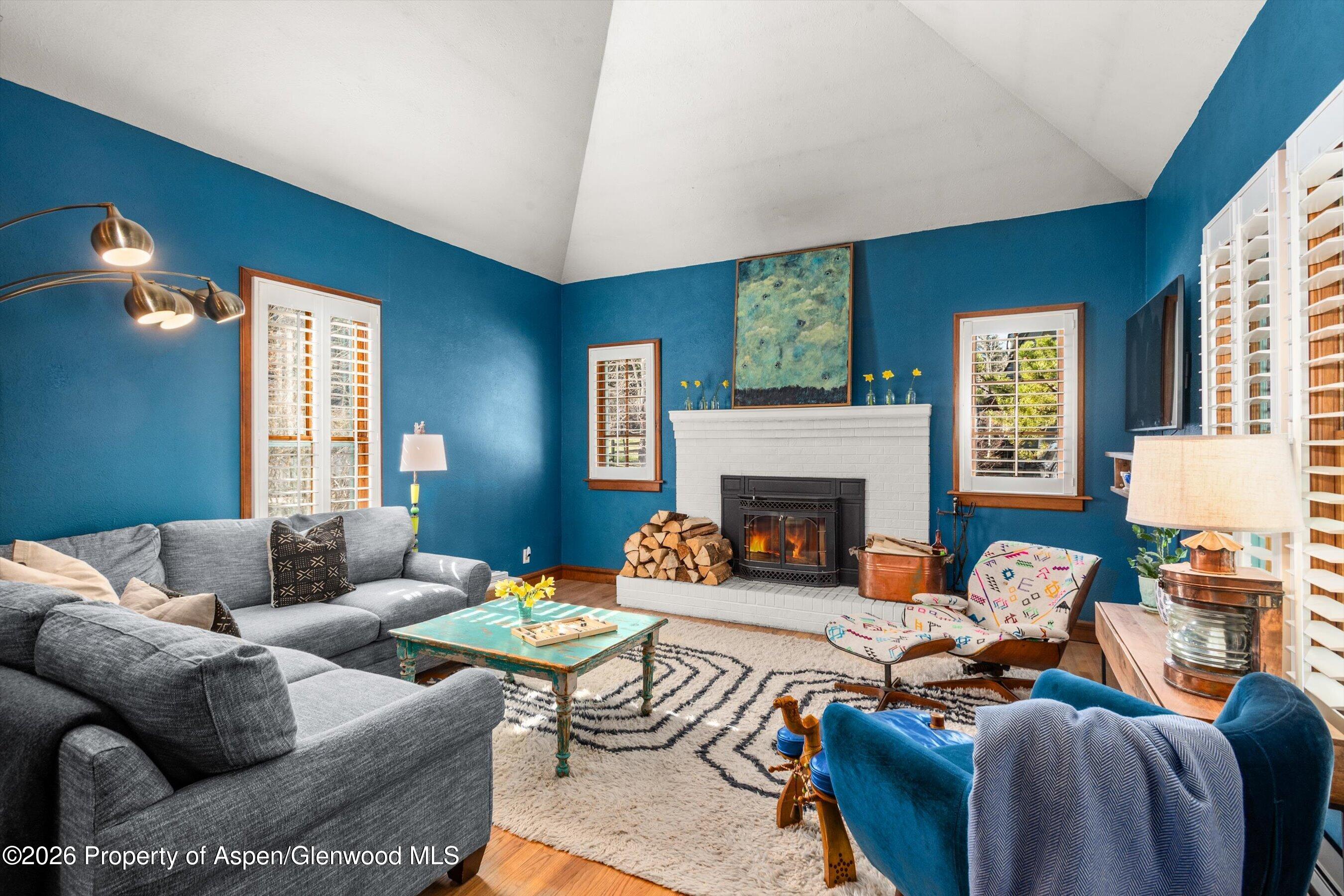 244 Redstone Boulevard Redstone, CO 81623 - Photo 10 of 55 a living room with furniture fireplace and a large window