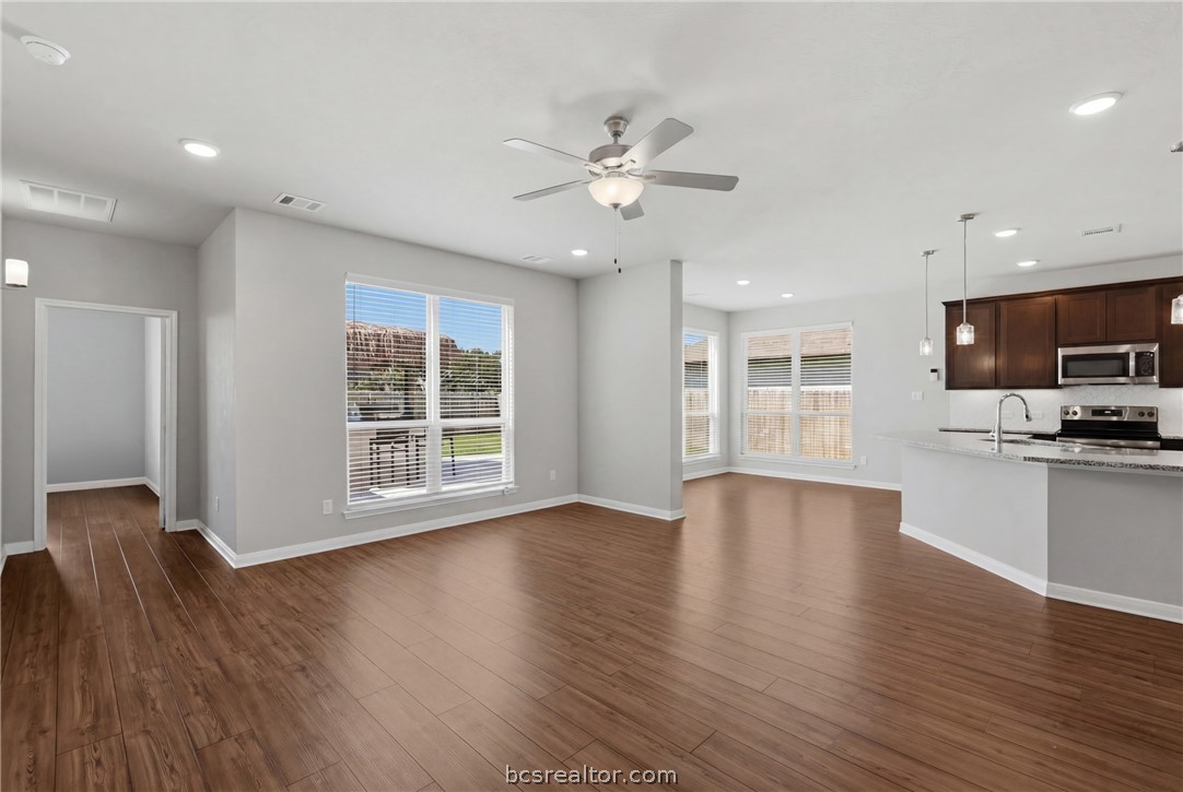 1922 Viva Road Bryan, TX 77807 - Photo 11 of 45 Inviting open-concept living room offering a spacious and connected layout.