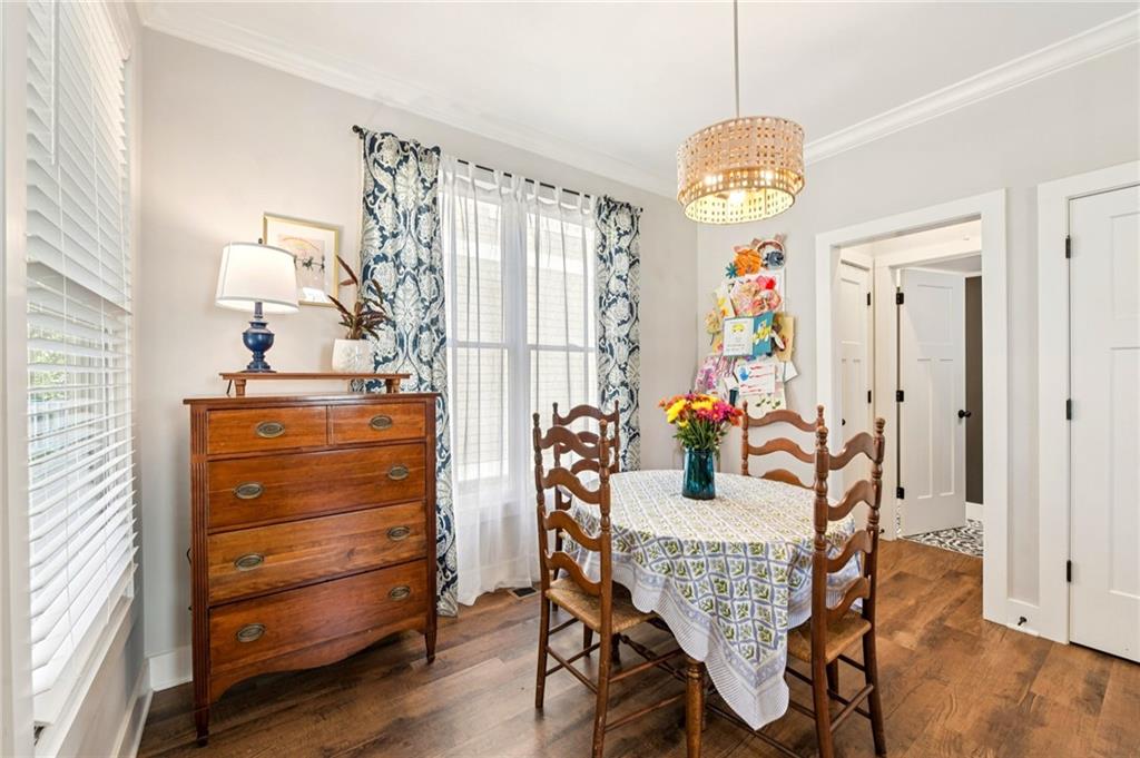 406 Bell Street Monroe, GA 30655 - Photo 16 of 60 a view of a dining room with furniture and a window