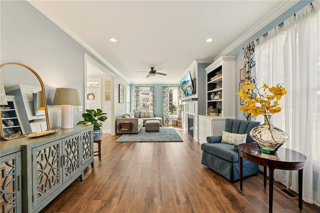 406 Bell Street Monroe, GA 30655 - Photo 18 of 60 a living room with furniture and wooden floor