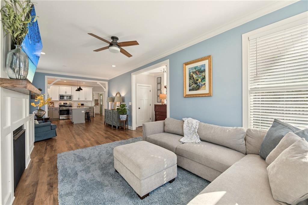 406 Bell Street Monroe, GA 30655 - Photo 19 of 60 a living room with furniture and a fireplace