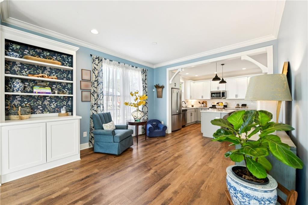 406 Bell Street Monroe, GA 30655 - Photo 20 of 60 a living room with furniture and a potted plant