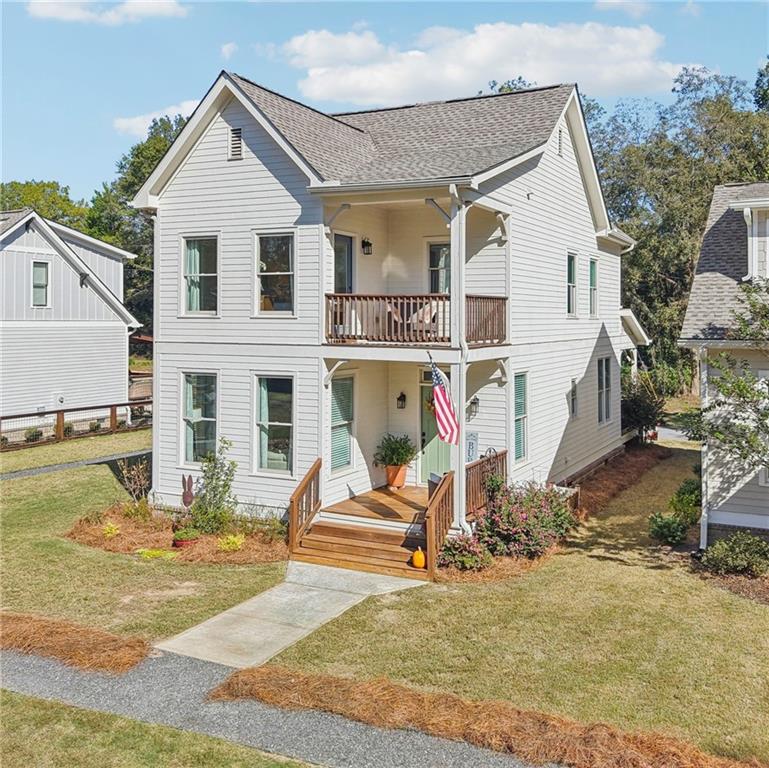 406 Bell Street Monroe, GA 30655 - Photo 2 of 60 a view of a house with swimming pool