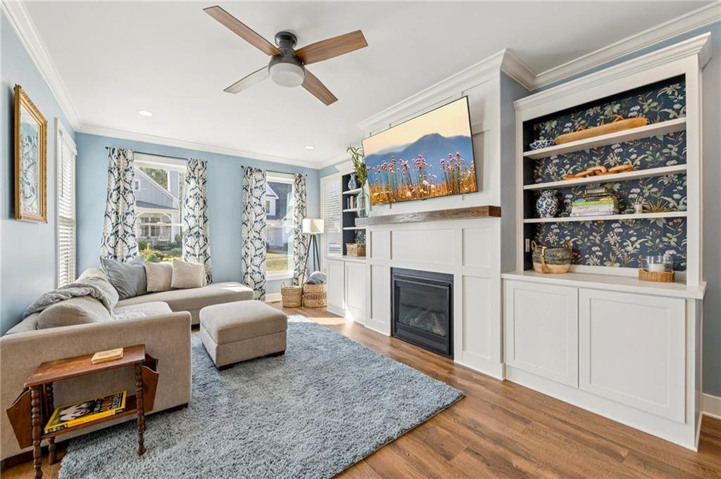 406 Bell Street Monroe, GA 30655 - Photo 22 of 60 a living room with furniture and a fireplace