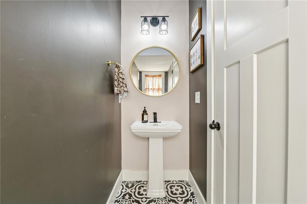 406 Bell Street Monroe, GA 30655 - Photo 24 of 60 a bathroom with a sink and a mirror