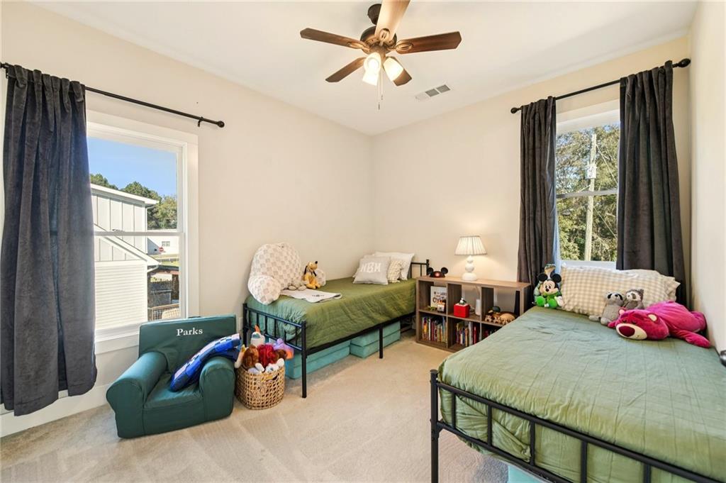 406 Bell Street Monroe, GA 30655 - Photo 31 of 60 a bedroom with furniture and a window