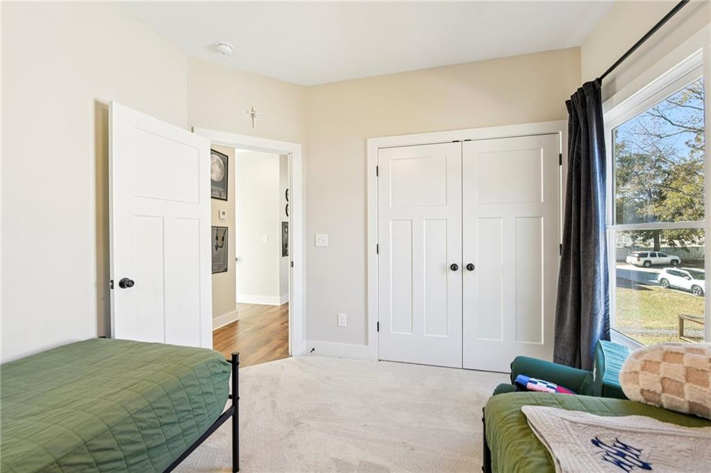 406 Bell Street Monroe, GA 30655 - Photo 32 of 60 a bedroom with a bed and a window
