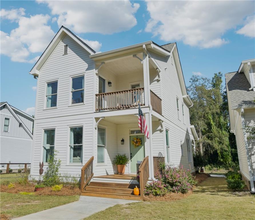 406 Bell Street Monroe, GA 30655 - Photo 4 of 60 a front view of a house with a yard