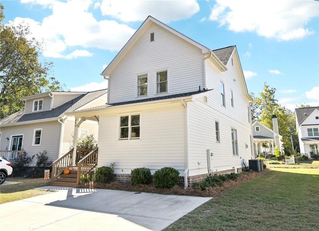 406 Bell Street Monroe, GA 30655 - Photo 41 of 60 a view of a house with backyard