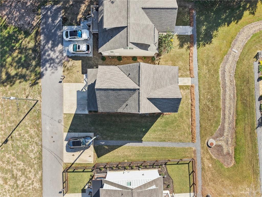 406 Bell Street Monroe, GA 30655 - Photo 43 of 60 an aerial view of residential houses with outdoor space