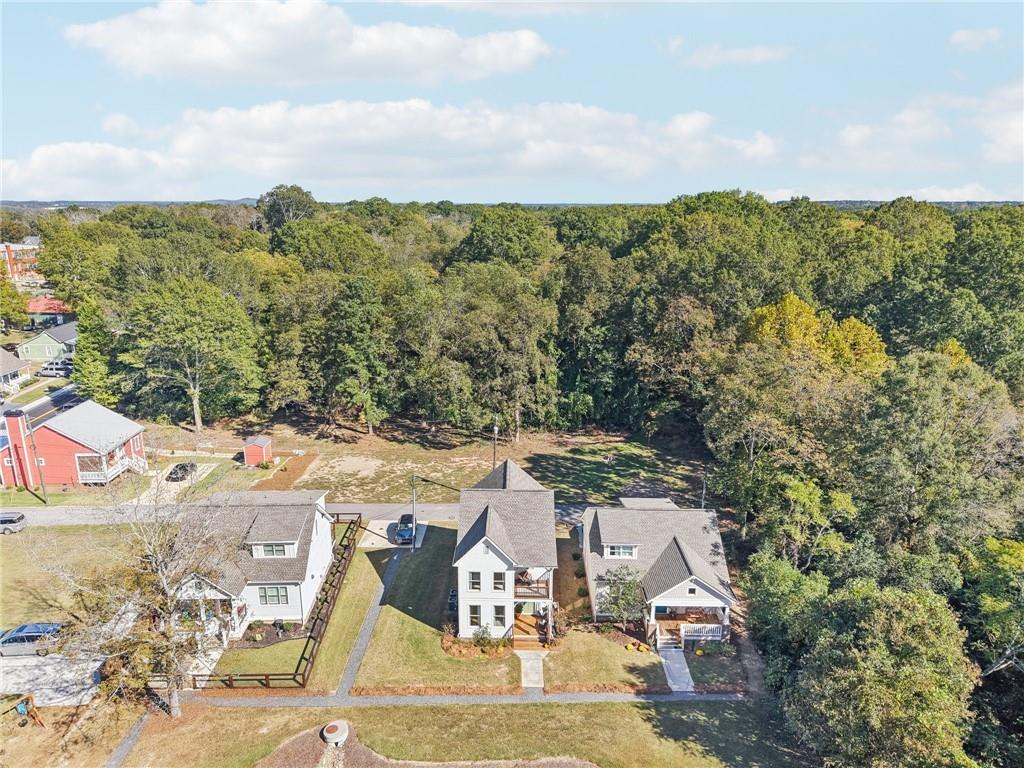 406 Bell Street Monroe, GA 30655 - Photo 45 of 60 an aerial view of residential houses with outdoor space