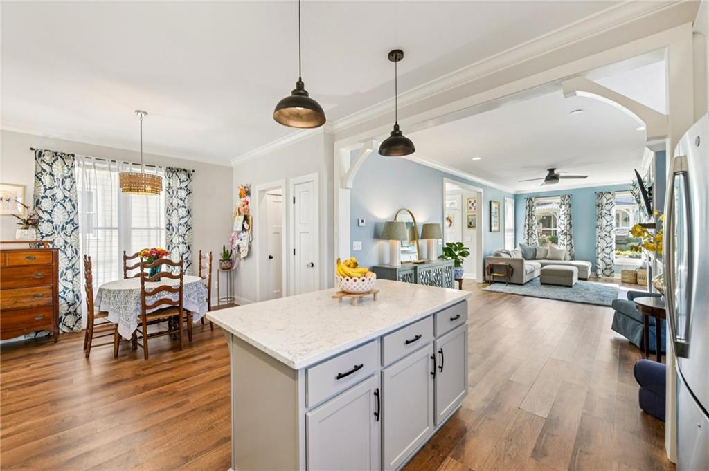 406 Bell Street Monroe, GA 30655 - Photo 8 of 60 a kitchen with a sink a counter space appliances and wooden floor