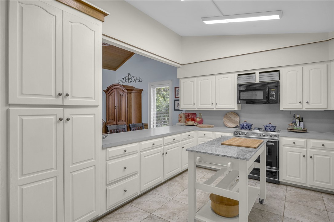 218 Northridge Drive Anderson, SC 29621 - Photo 9 of 50 A well-appointed kitchen showcasing ample cabinetry, tiled flooring, and a convenient center island.