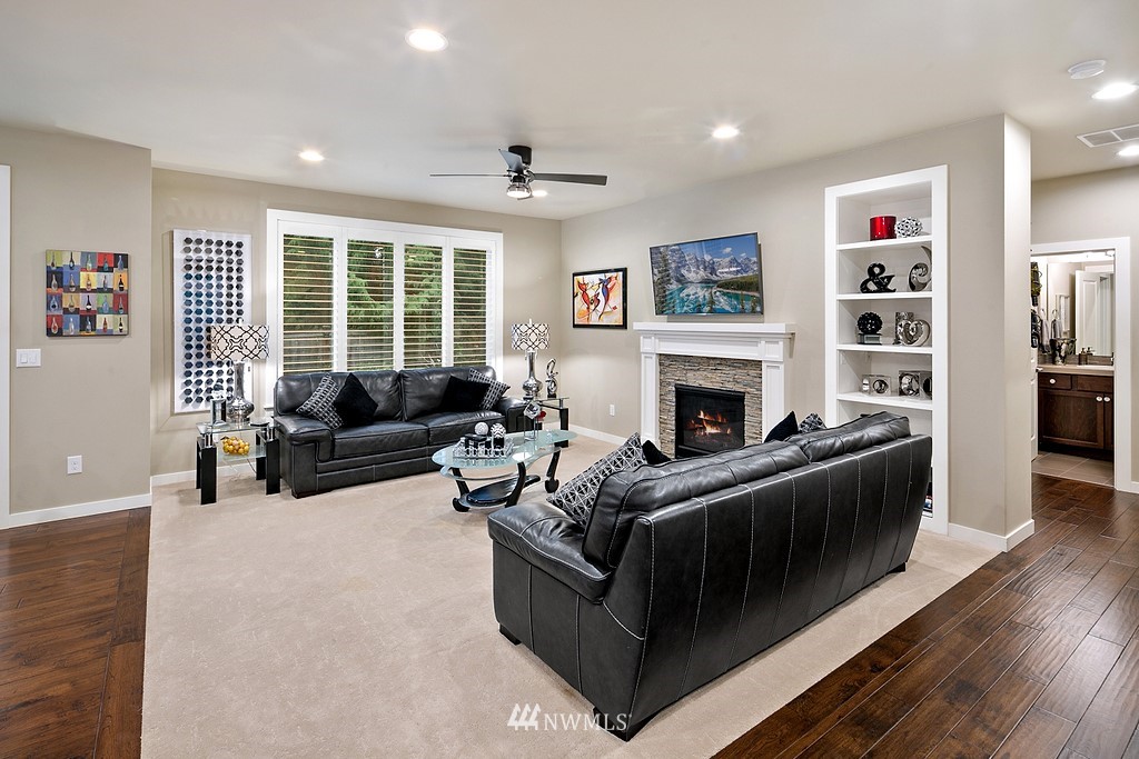 21920 37th Avenue Southeast Bothell, WA 98021 - Photo 15 of 39 a living room with furniture and a fireplace