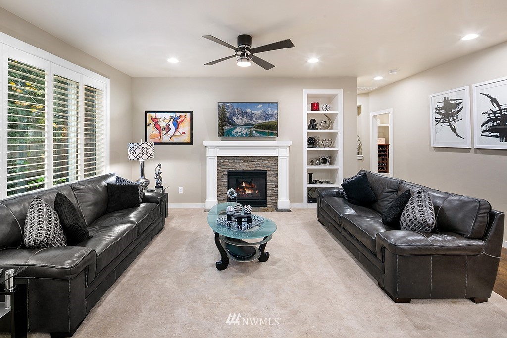 21920 37th Avenue Southeast Bothell, WA 98021 - Photo 19 of 39 a living room with furniture and a fireplace
