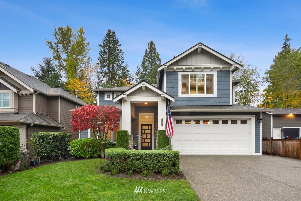 21920 37th Avenue Southeast Bothell, WA 98021 - Photo 3 of 39 a front view of a house with a yard and garage