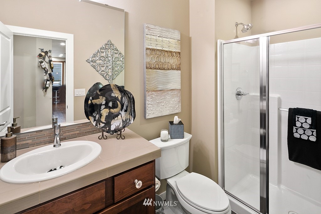 21920 37th Avenue Southeast Bothell, WA 98021 - Photo 21 of 39 a bathroom with a sink toilet and shower