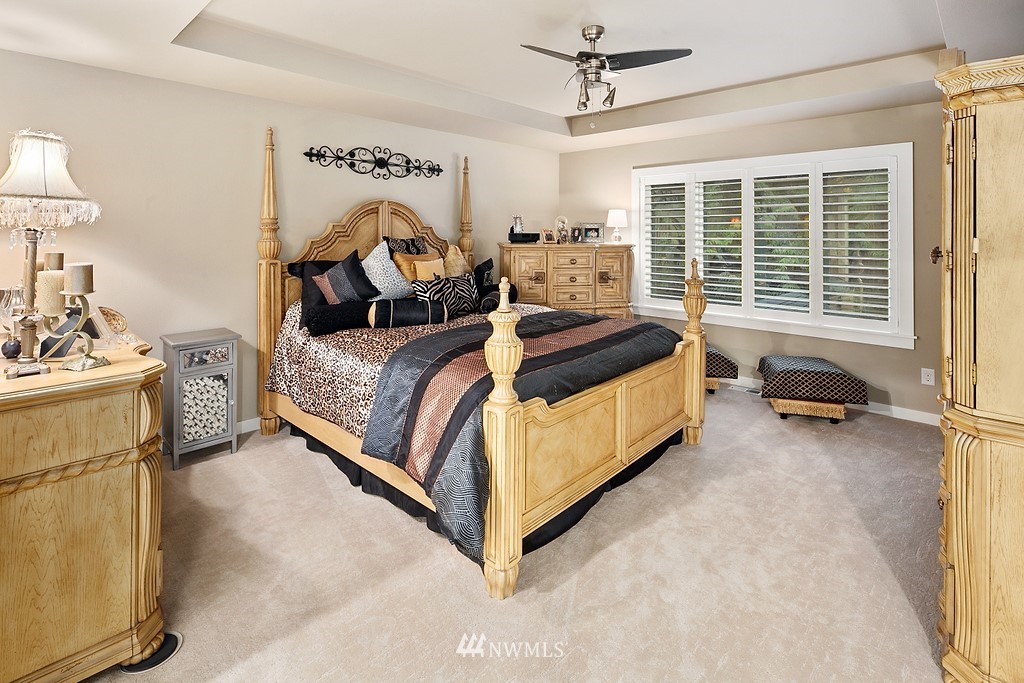 21920 37th Avenue Southeast Bothell, WA 98021 - Photo 26 of 39 a bed room with a bed and a chair