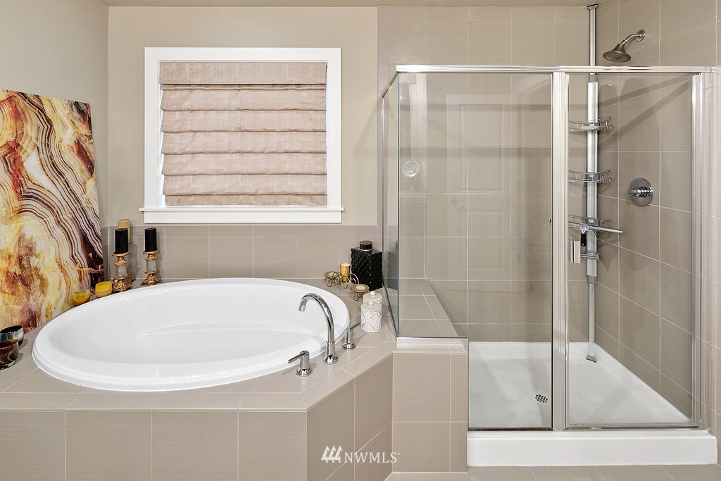 21920 37th Avenue Southeast Bothell, WA 98021 - Photo 28 of 39 a white bath tub sitting next to a window