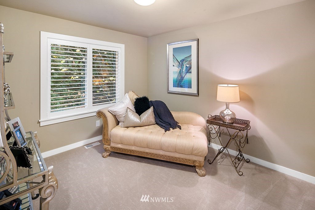 21920 37th Avenue Southeast Bothell, WA 98021 - Photo 31 of 39 a bedroom with a bed and a window