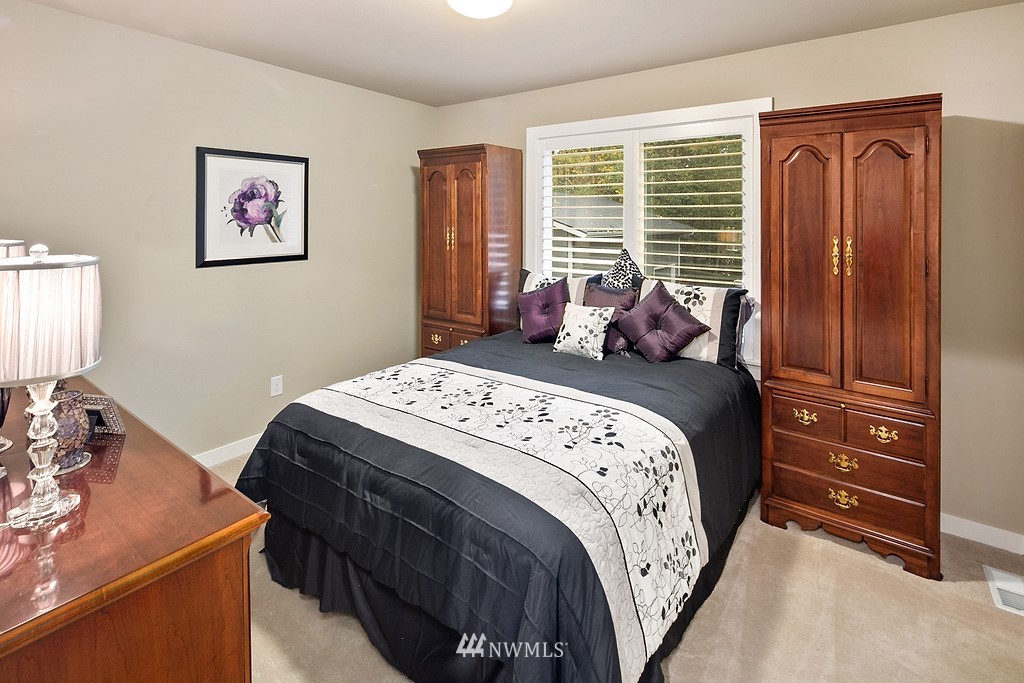 21920 37th Avenue Southeast Bothell, WA 98021 - Photo 33 of 39 a bedroom with a bed and a window