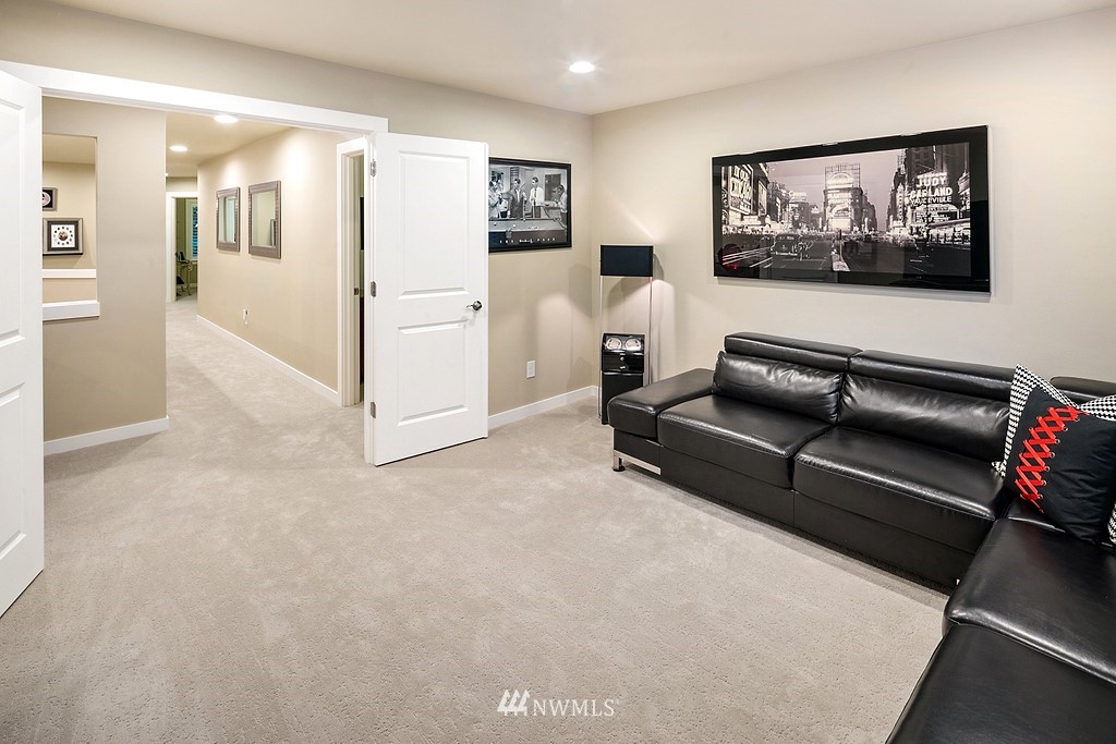 21920 37th Avenue Southeast Bothell, WA 98021 - Photo 35 of 39 a living room with furniture and a painting on the wall