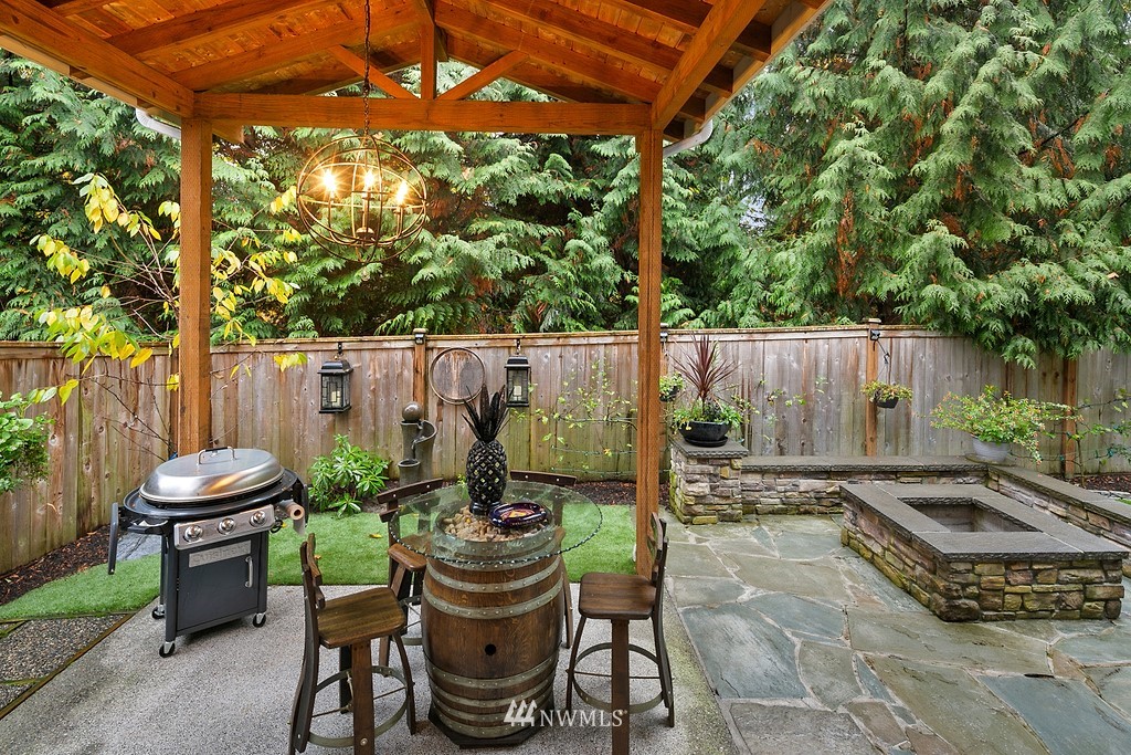 21920 37th Avenue Southeast Bothell, WA 98021 - Photo 36 of 39 a view of a table and chairs in patio