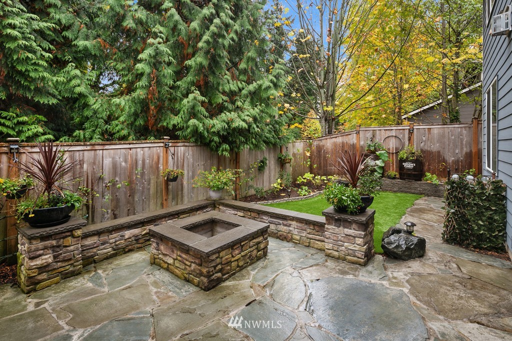21920 37th Avenue Southeast Bothell, WA 98021 - Photo 37 of 39 a view of a backyard with plants and outdoor seating