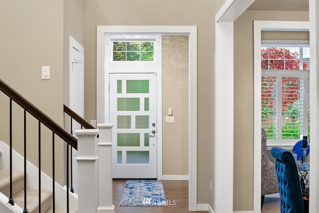 21920 37th Avenue Southeast Bothell, WA 98021 - Photo 5 of 39 a view of an entryway with wooden floor and windows