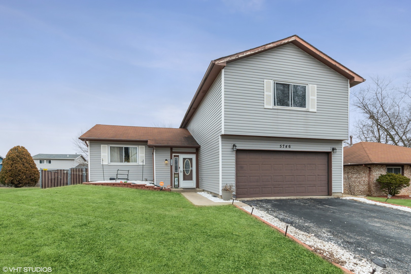 5746 Timberlane Road Matteson, IL 60443 - Photo 1 of 19 a front view of a house with a garden and yard