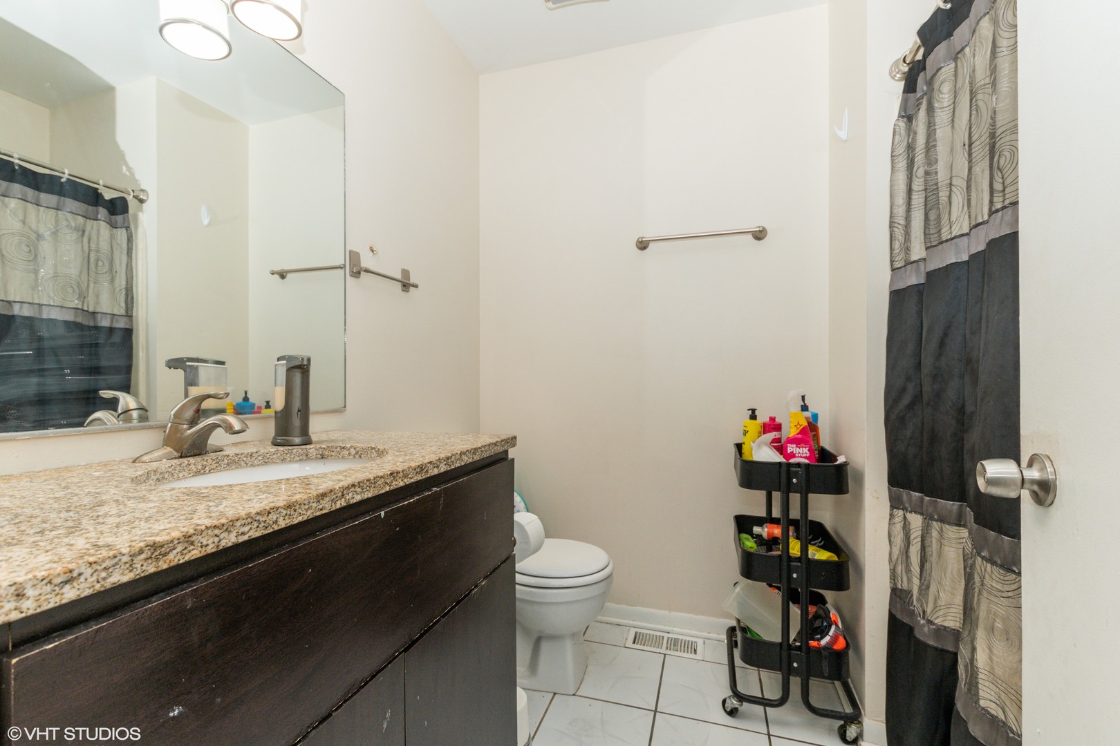 5746 Timberlane Road Matteson, IL 60443 - Photo 14 of 19 a bathroom with a granite countertop sink a toilet and a shower