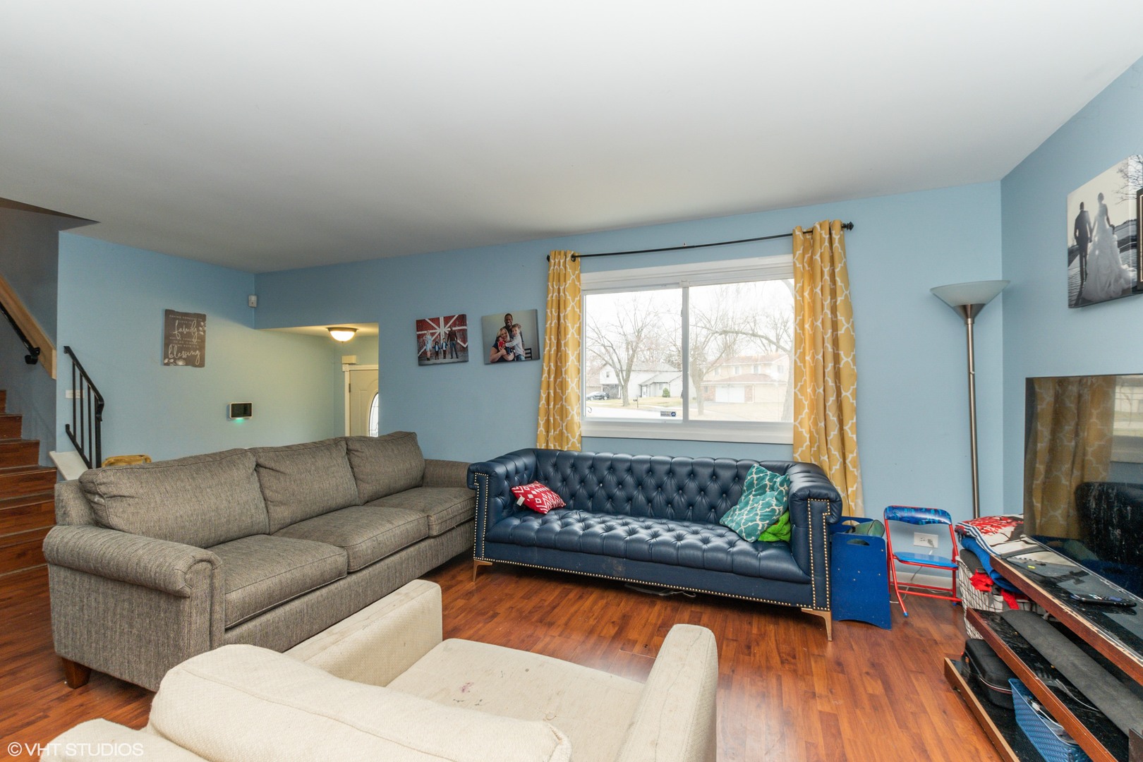 5746 Timberlane Road Matteson, IL 60443 - Photo 2 of 19 a living room with furniture fireplace and flat screen tv