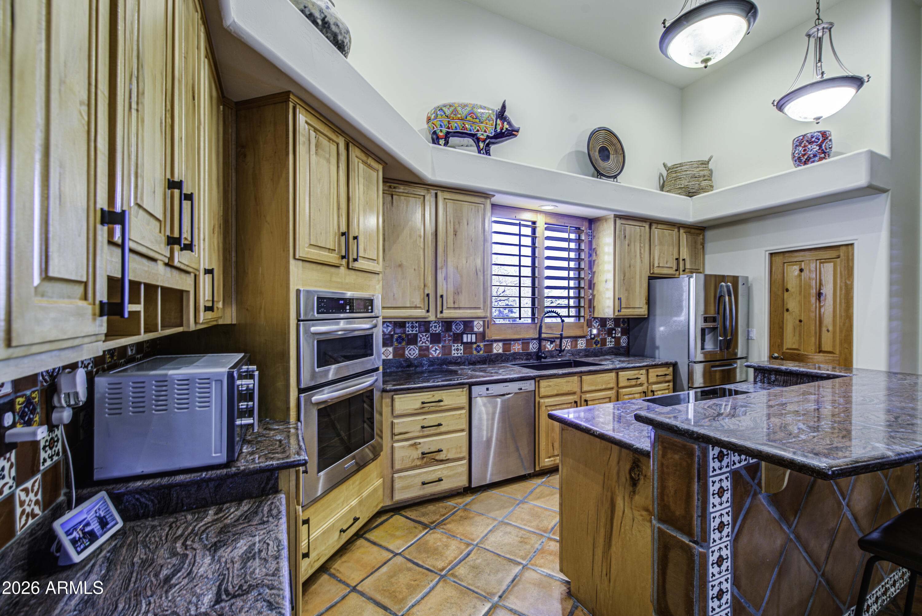 8540 East McDowell Road, Unit 122 Mesa, AZ 85207 - Photo 11 of 75 a kitchen with a stove a sink and a refrigerator