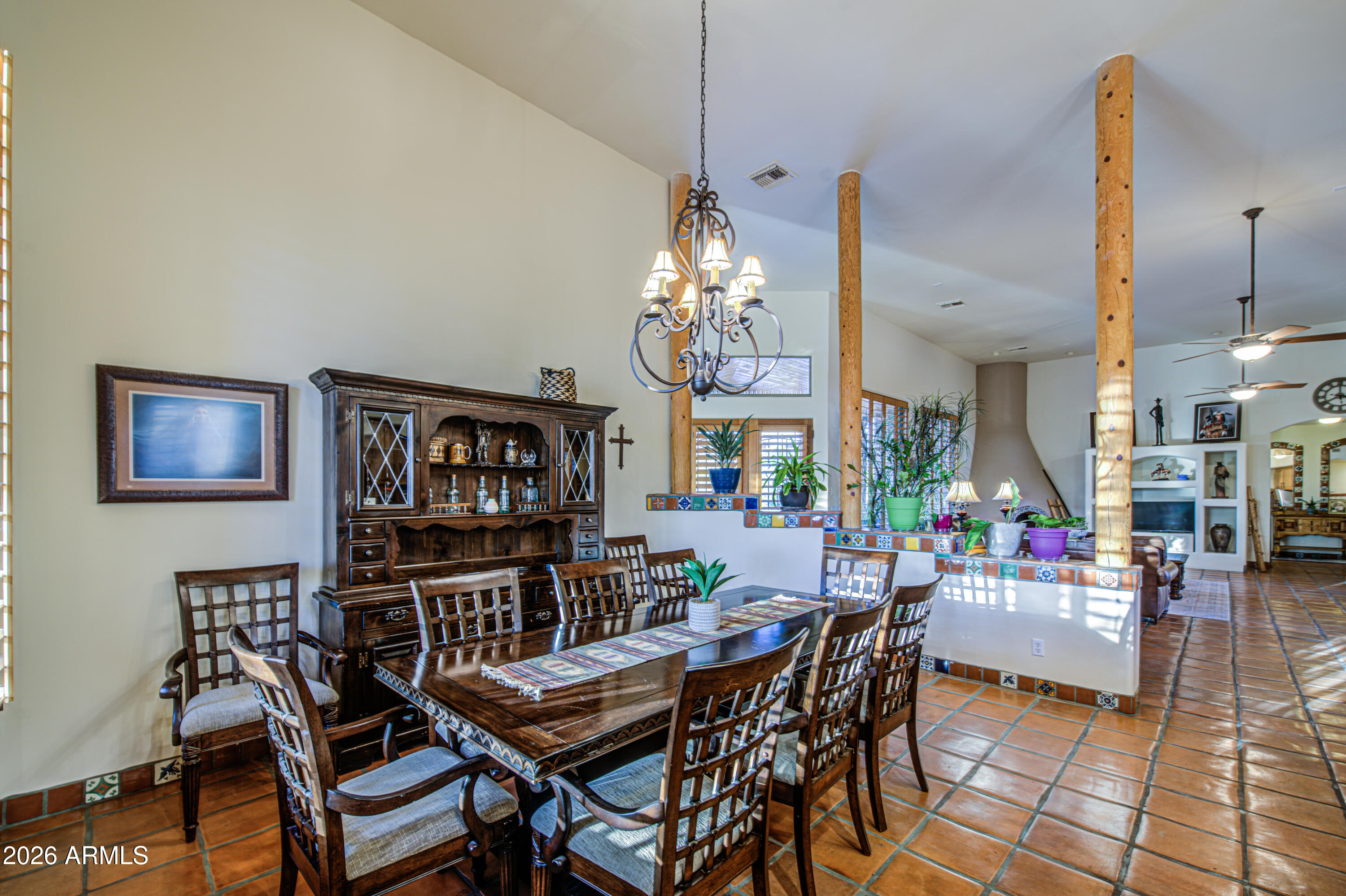 8540 East McDowell Road, Unit 122 Mesa, AZ 85207 - Photo 13 of 75 a view of a dining room with furniture and chandelier