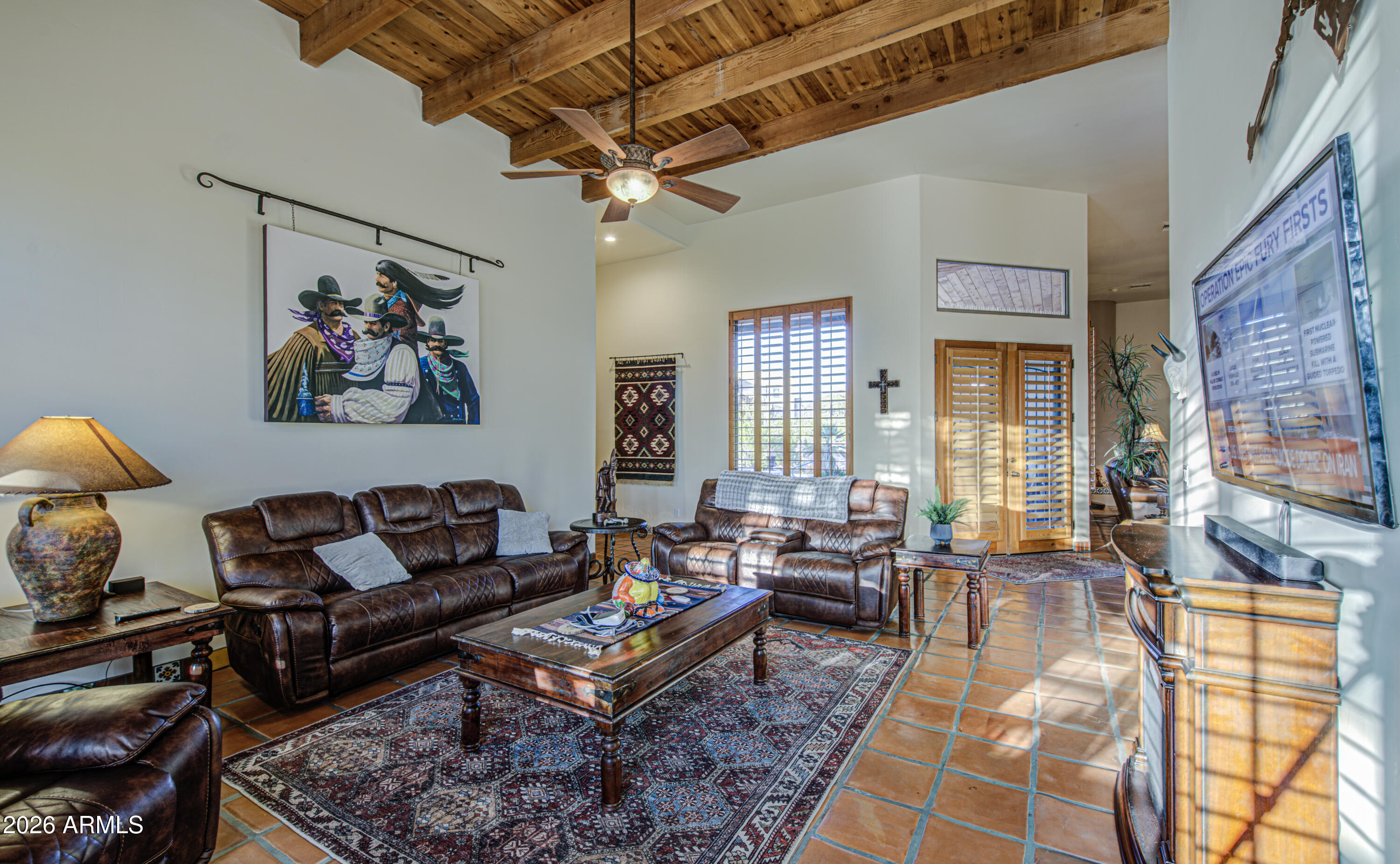 8540 East McDowell Road, Unit 122 Mesa, AZ 85207 - Photo 18 of 75 a living room with furniture a rug and a chandelier